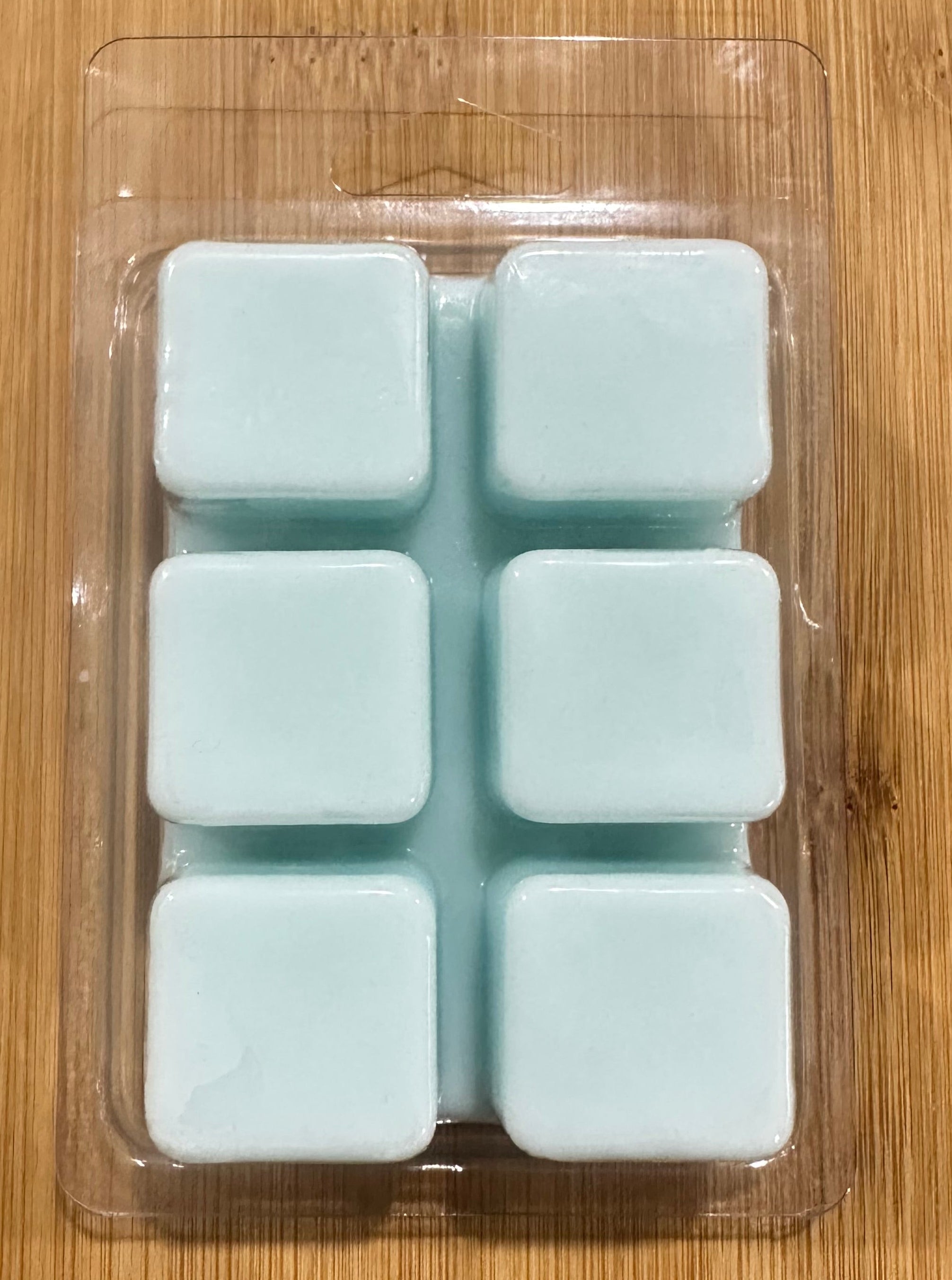 Cloud Luxe soy wax melt cubes in soft blue, with warm vanilla and chamomile scent, natural soy wax, premium fragrance oils.