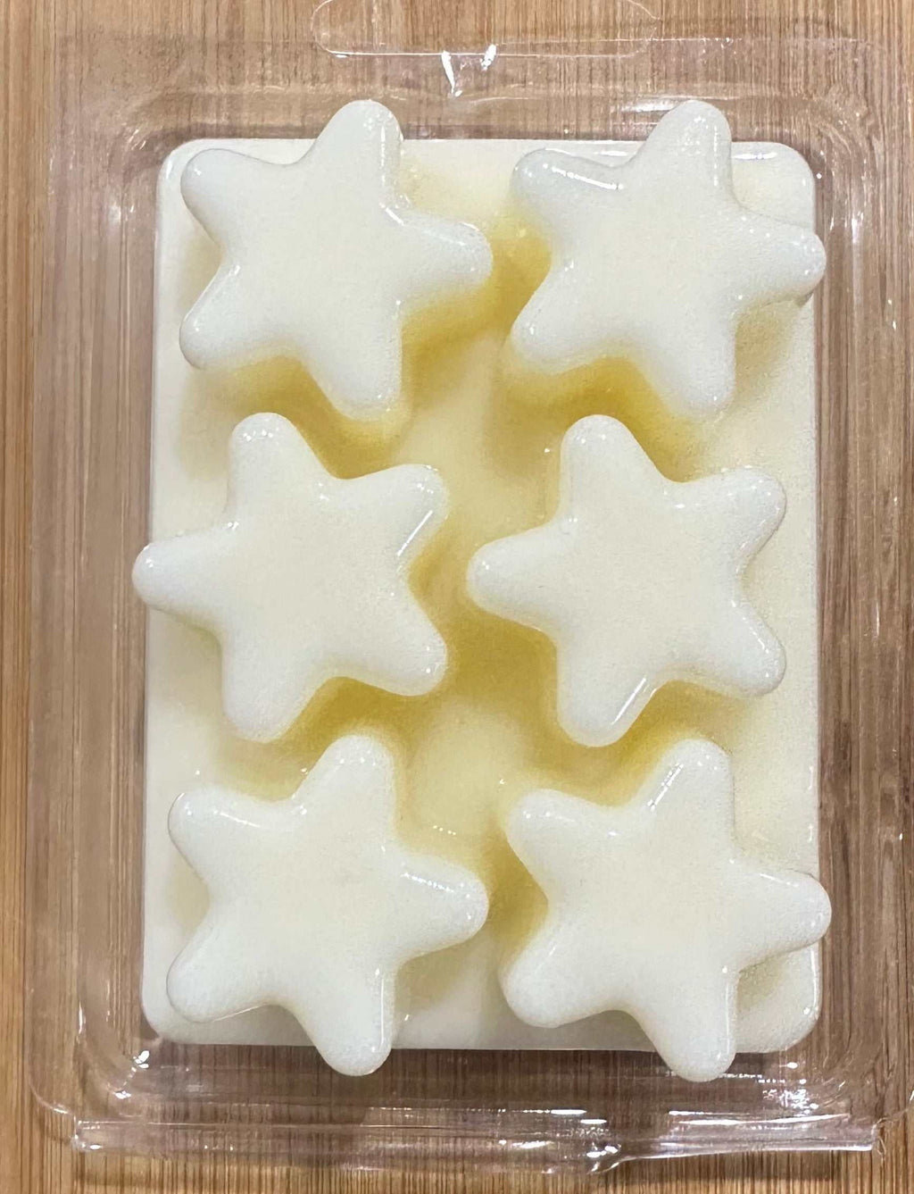 Morning Star soy wax melt in star shapes, clean floral scent with jasmine and sandalwood, natural ingredients, packaged in clear plastic.