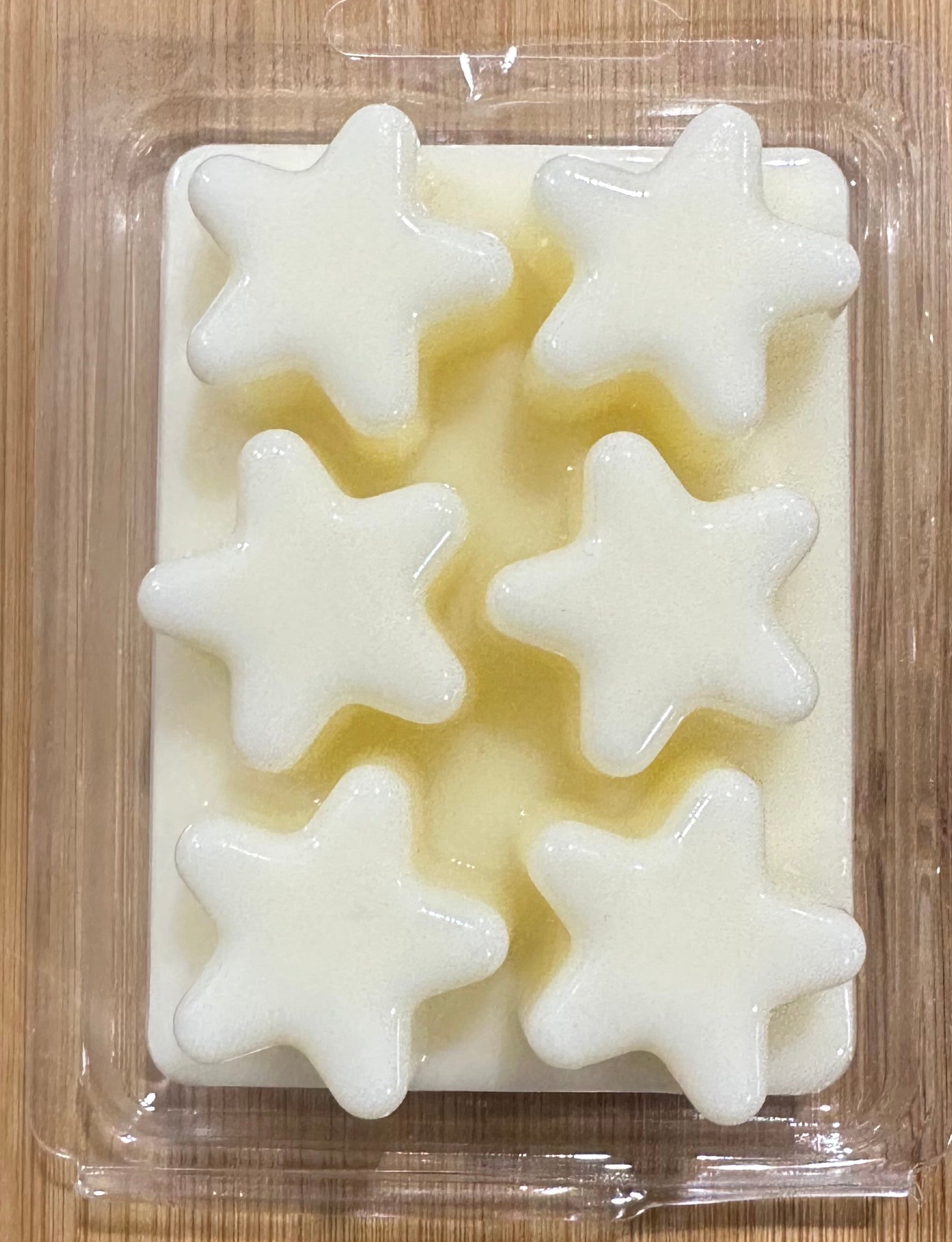 Morning Star soy wax melt in star shapes, clean floral scent with jasmine and sandalwood, natural ingredients, packaged in clear plastic.