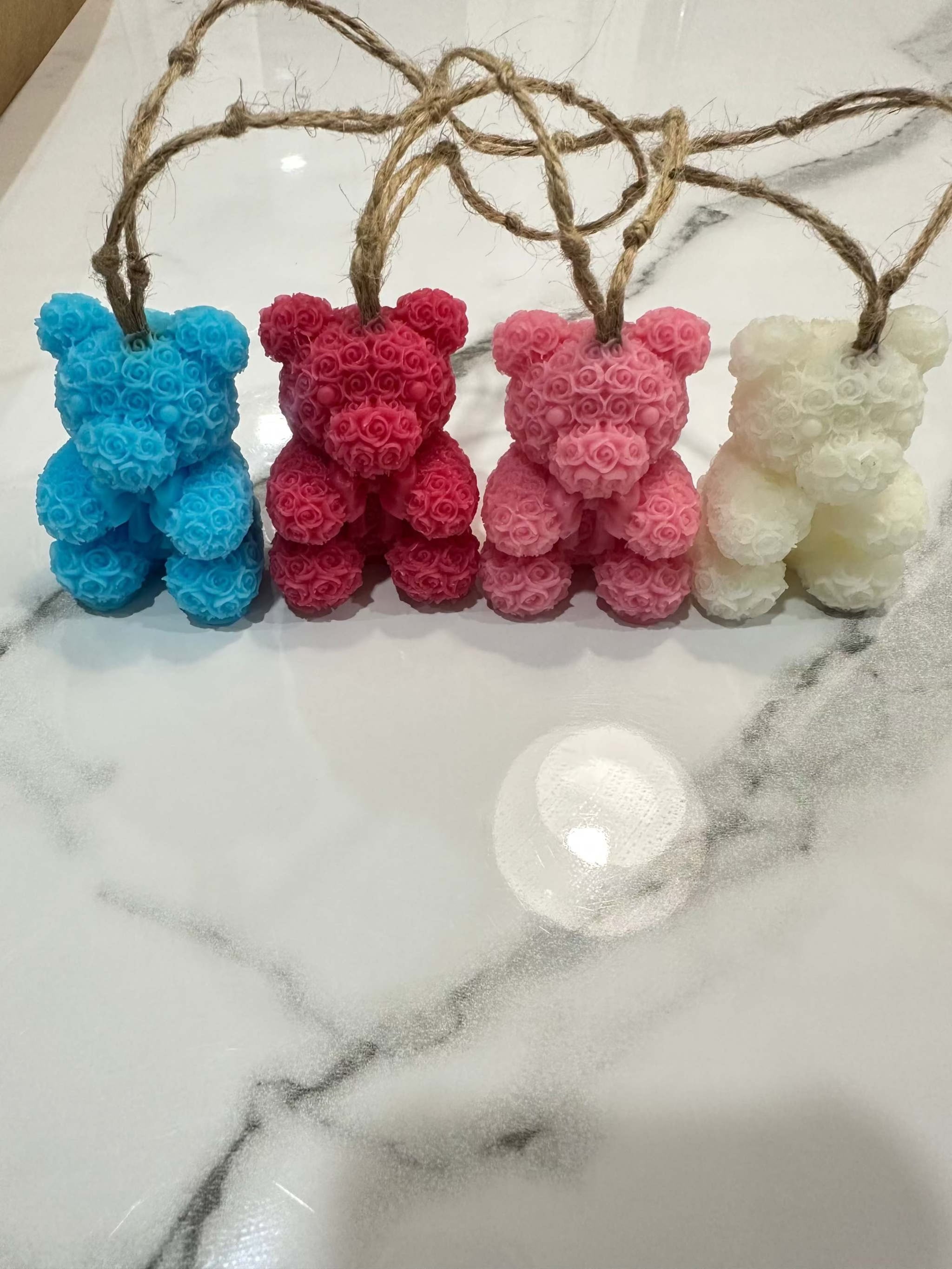4-pack rose teddy soap on a rope in blue, red, pink, and cream with floral details and jute hanging ropes