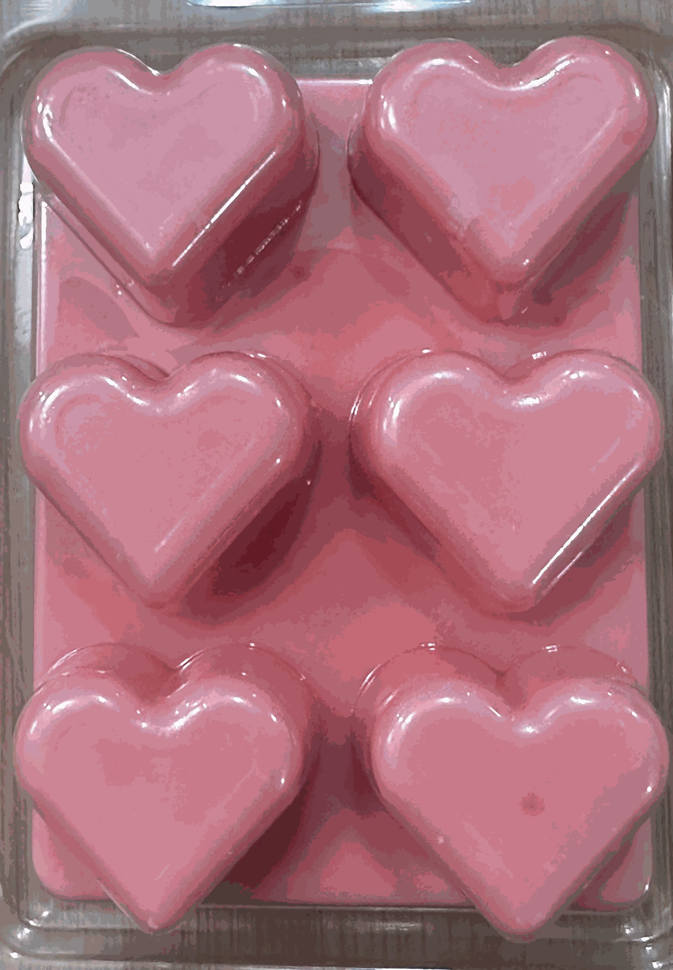 Roselume soy wax melt heart-shaped pink cubes with rose and vanilla scent in clear packaging