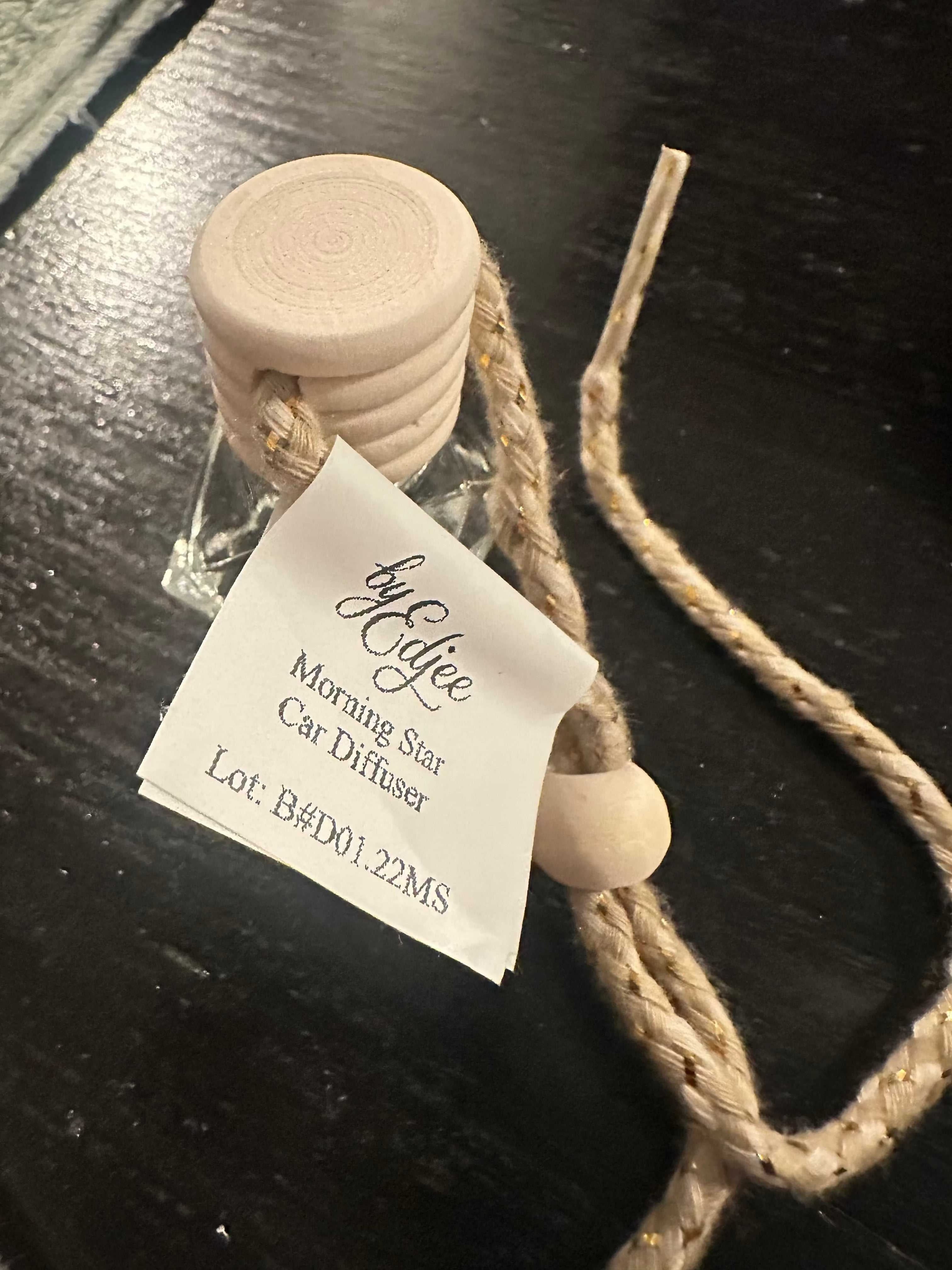 Morning Star Hanging Car Diffuser with elegant jasmine scent hanging in car interior